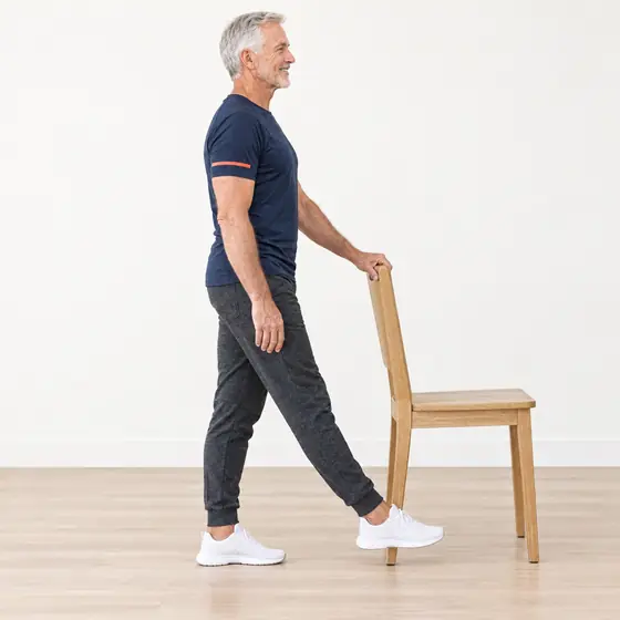 Toe Taps: Stand tall holding the chair back.