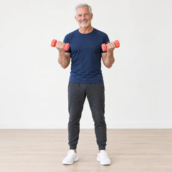 Bicep Curl: Stand tall, a dumbbell in each hand, palms forward.