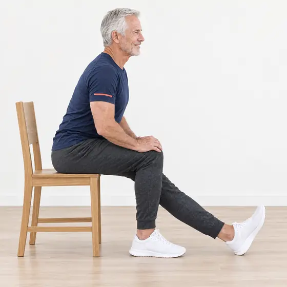 Seated Hamstring Stretch: Sit at the front of the chair, one leg straight, heel down, toes up.