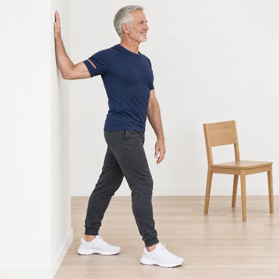 Wall Chest Stretch: Stand beside a wall, palm flat on it at shoulder height, arm straight.
