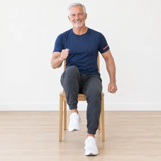 Seated March: Sit tall near the front of the chair, feet flat.