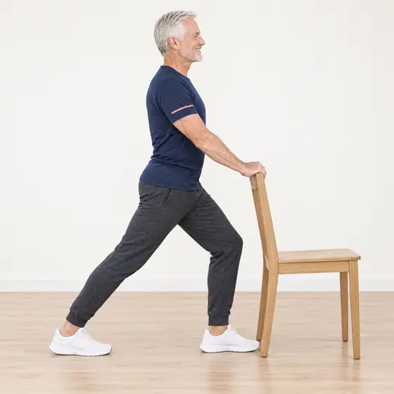 Calf Stretch: Hold the chair back, step one foot back.