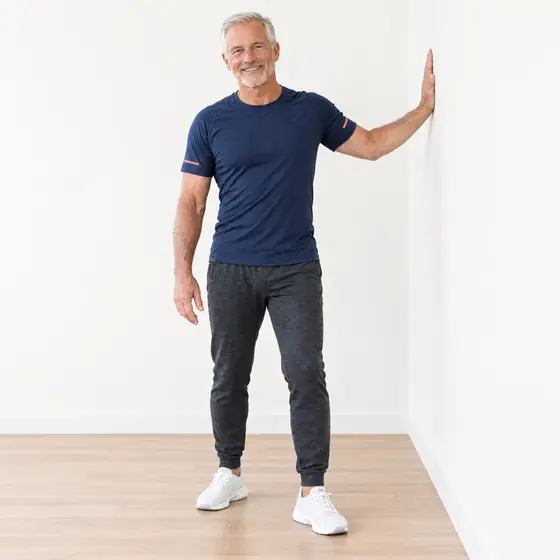 Chest Stretch: Stand side-on to the wall, an arm's length away.